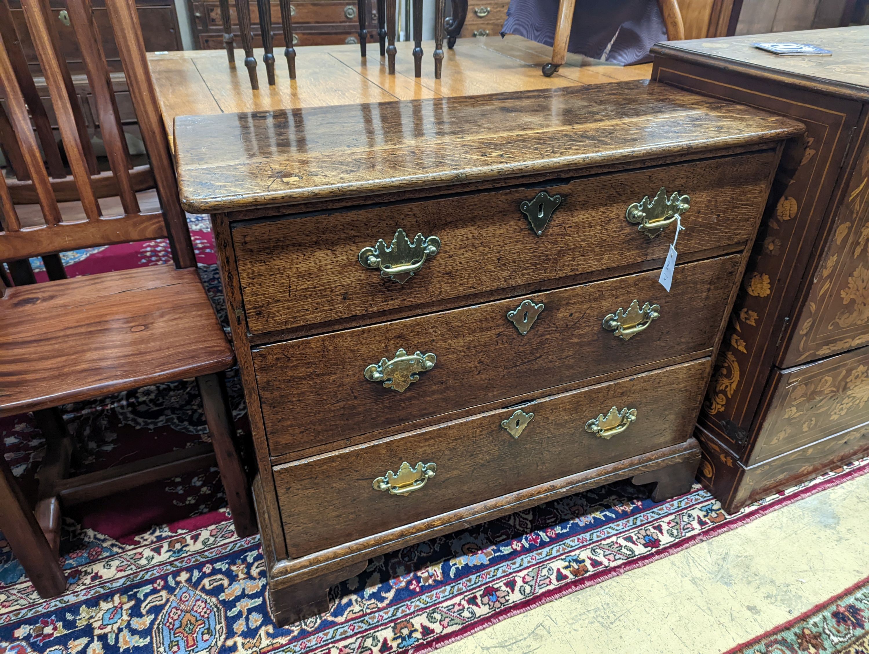 An 18th century oak three drawer chest, width 92cm, depth 39cm, height 80cm